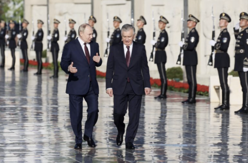 Photo by the Russian Sputnik agency. Vladimir Putin, left, and Uzbek President Shavkat Mirziyoyev, right.